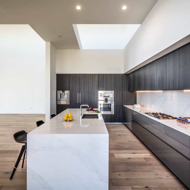 kitchen with high-end gaggenau appliances in the penthouse condo unit 801 of the mond at the museums