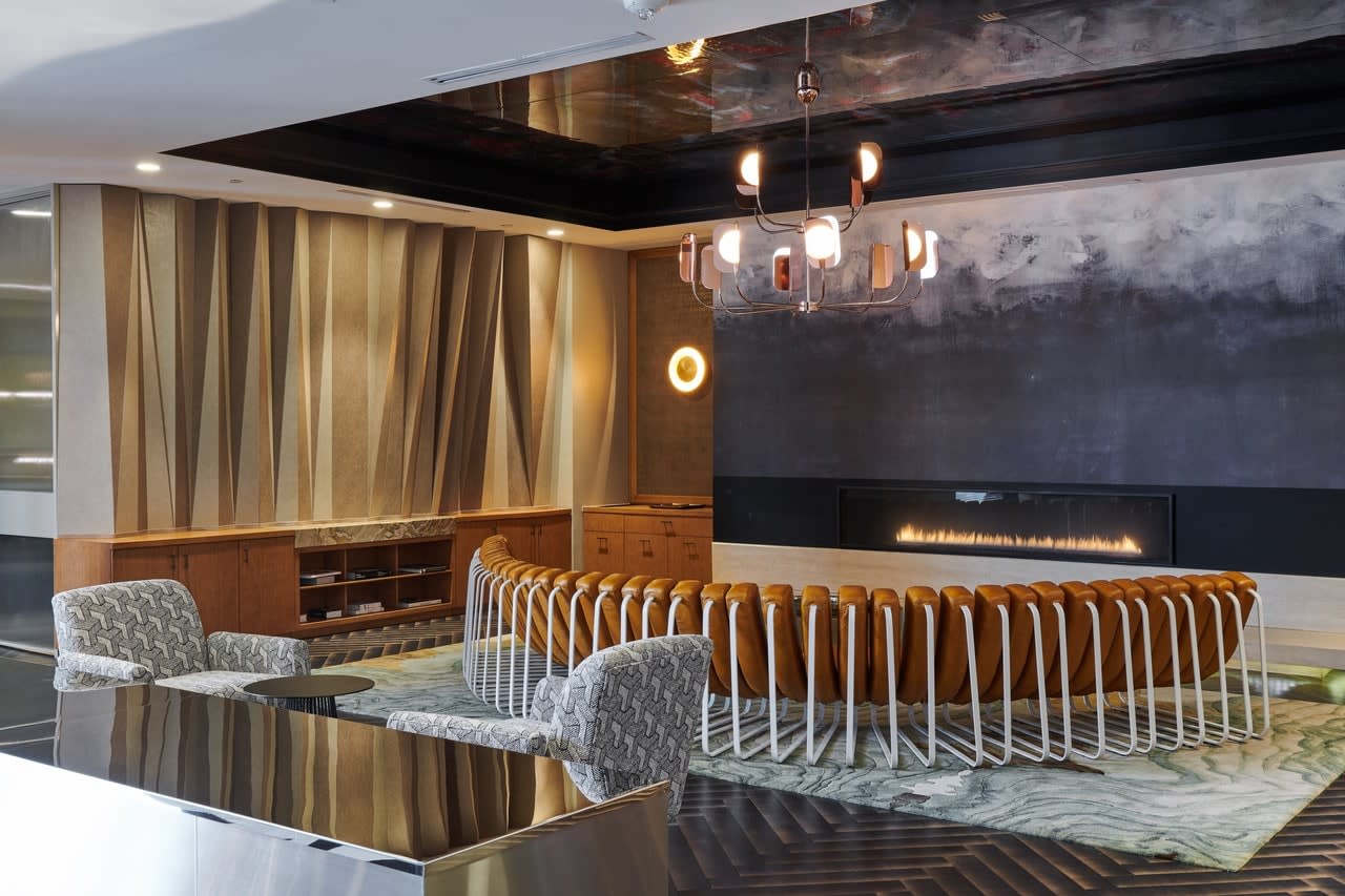 houston's arabella high rise condos lounge area with artful seating and unique fireplace