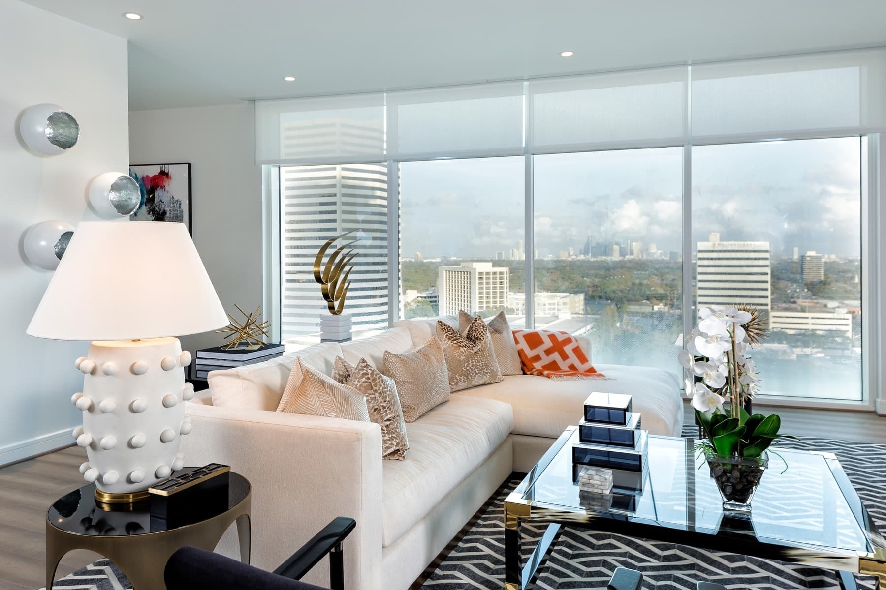 living area with panoramic views of downtown houston in the model unit of arabella luxury condos in houston