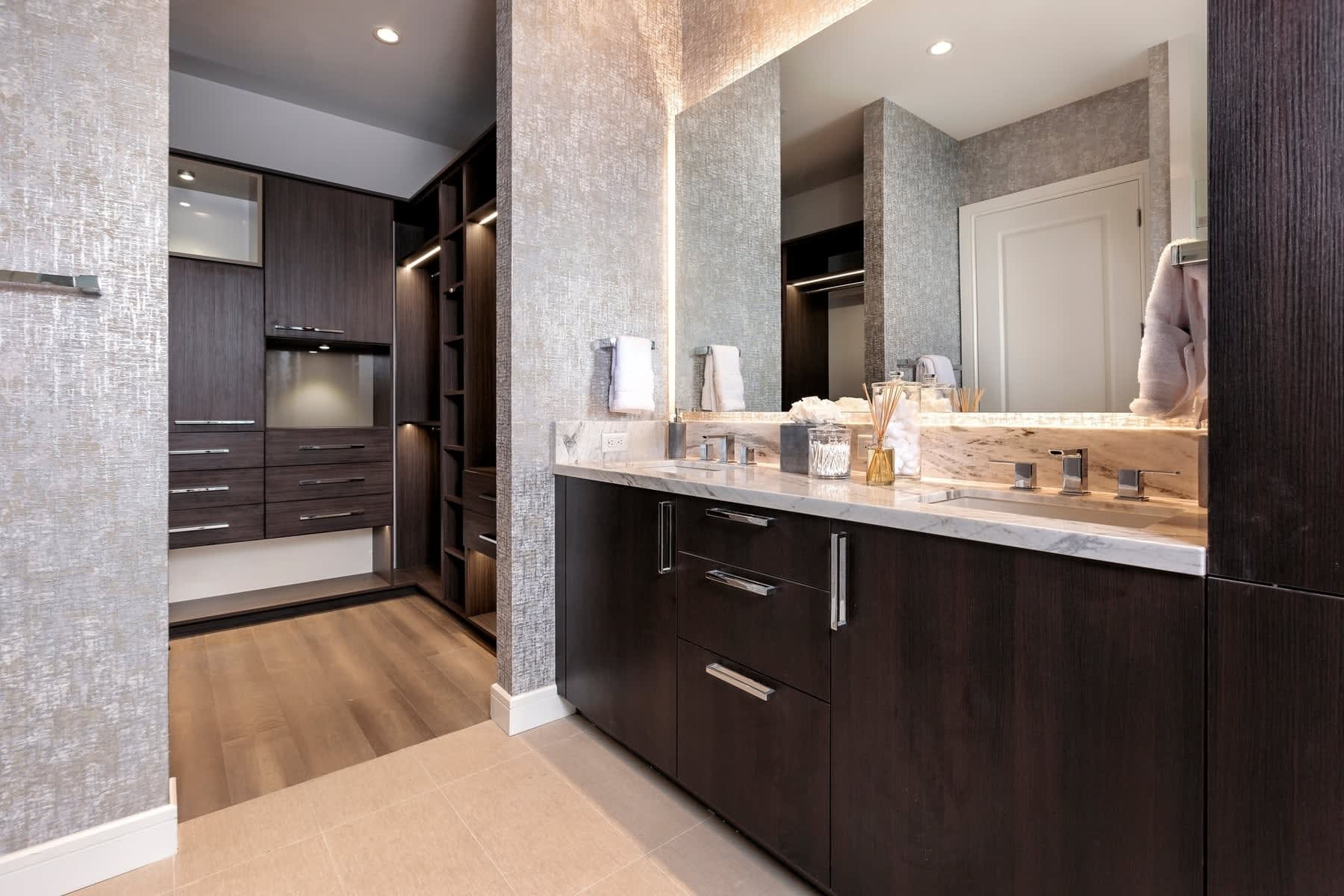 master bathroom and custom walk-in closet in the model unit of arabella luxury condos in houston