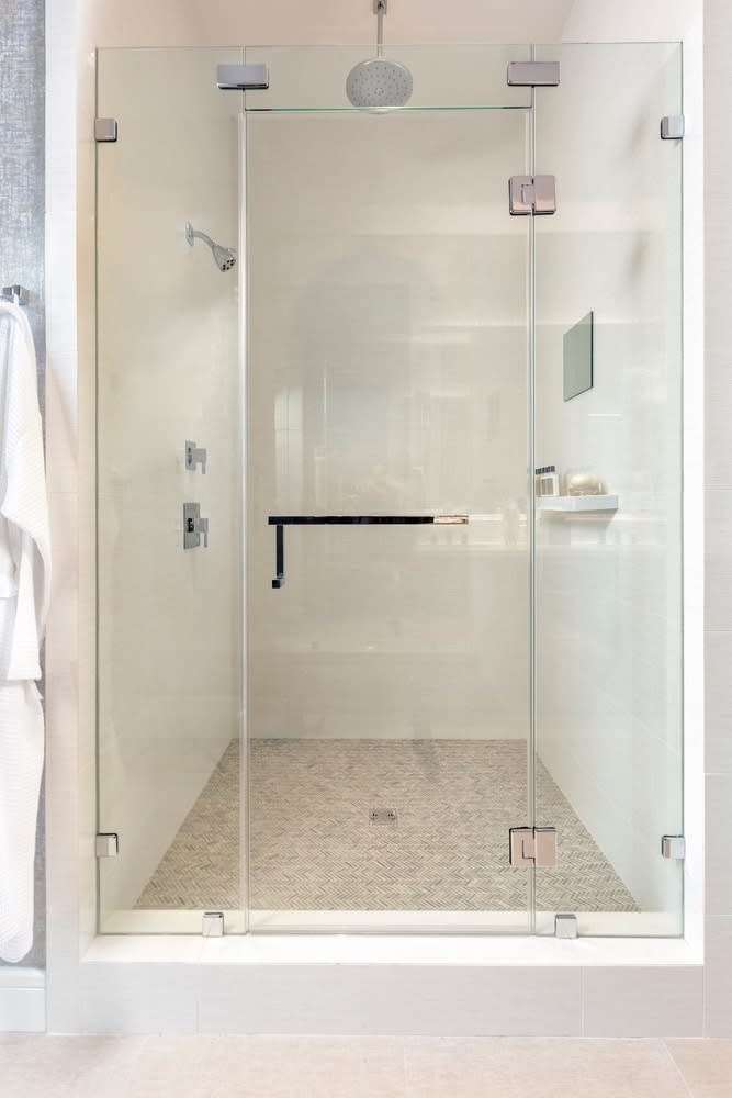 custom shower in the master bath of the the model unit of arabella high rise in houston