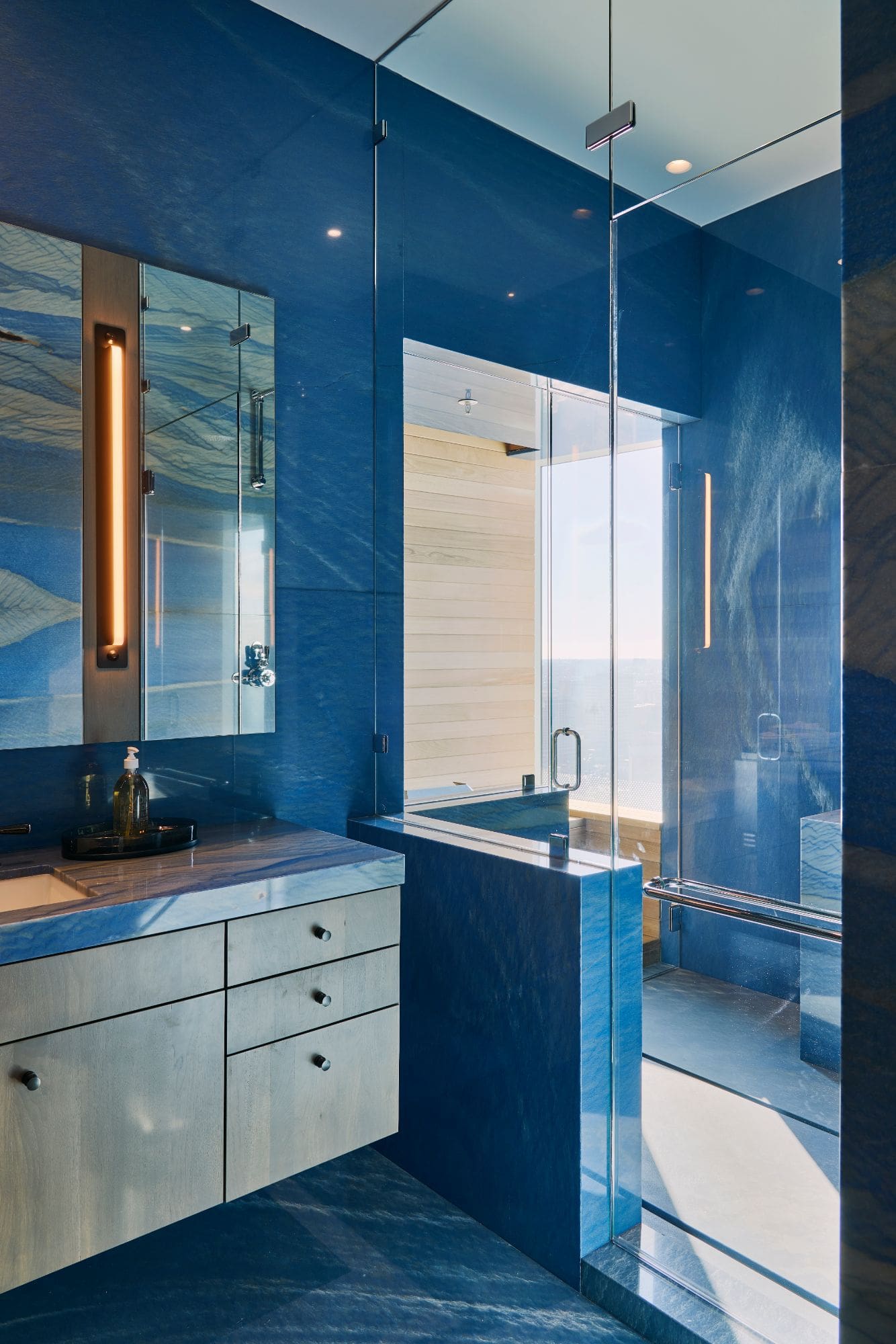 "his" blue marble master bath inside a penthouse of the arabella luxury high rise in houston