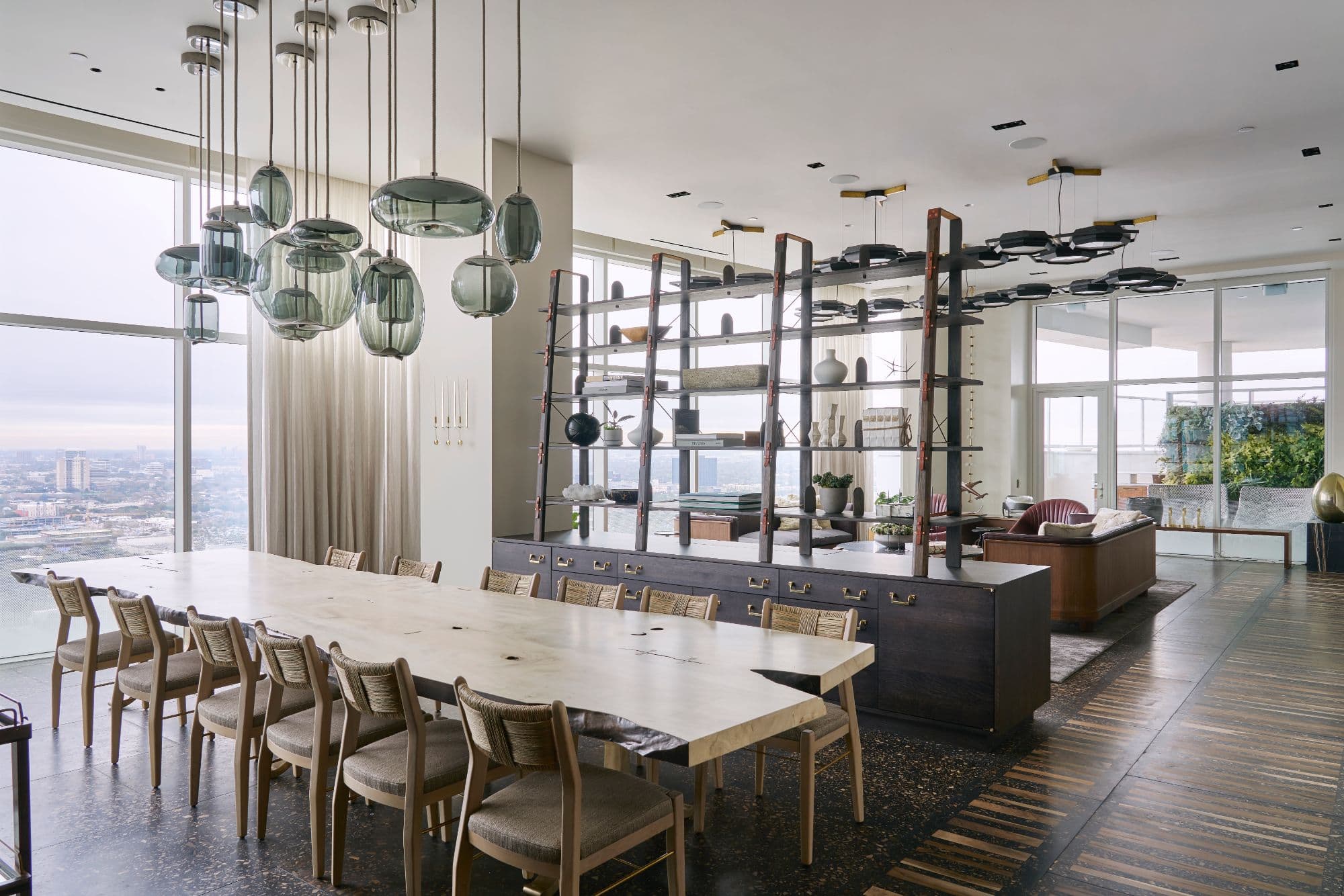 dining area with ultra-modern chandelier inside a penthouse of the arabella luxury high rise in houston