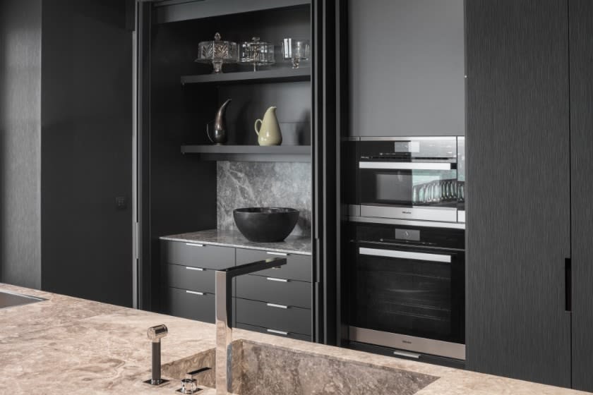 hidden food prep and storage area and ovens in the huntingdon luxury high-rise on kirby in houston