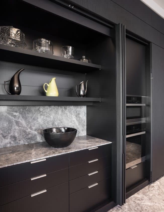 hidden food prep and serving area in high-end kitchen in the huntingdon luxury high-rise on kirby in houston