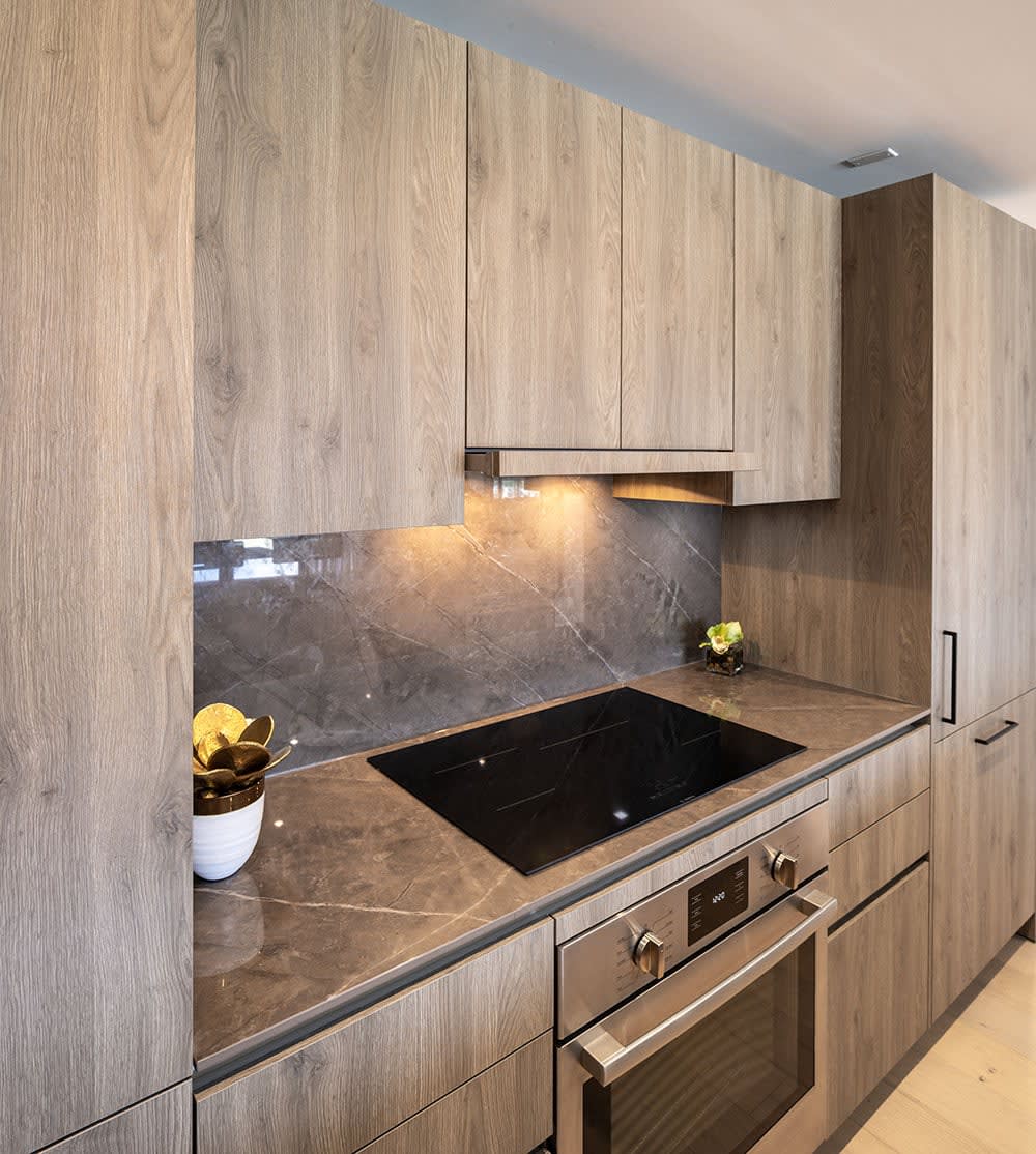 trondheim pembroke oak cabinetry finish and dekton korso counter installed in the parklane rustic chic collection