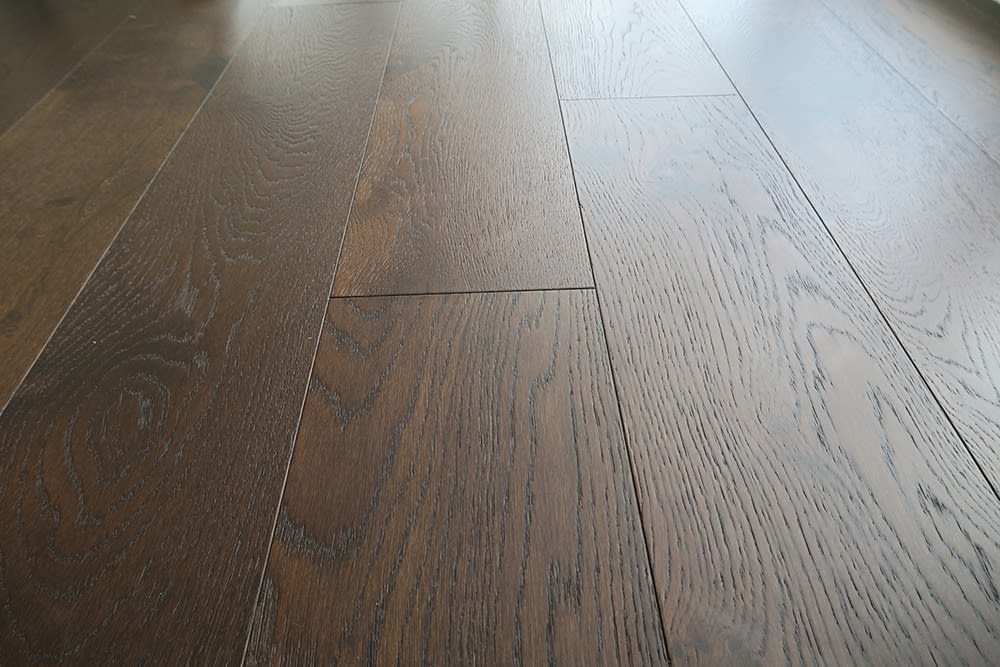 sample of chateau st jean wood flooring used in eggersmann designed luxury high rise residences in The Parklane Houston