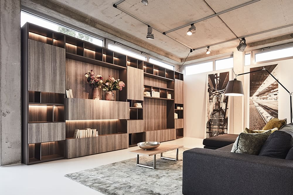 custom luxury library wall with storage and display shelves designed by eggermann german cabinetry