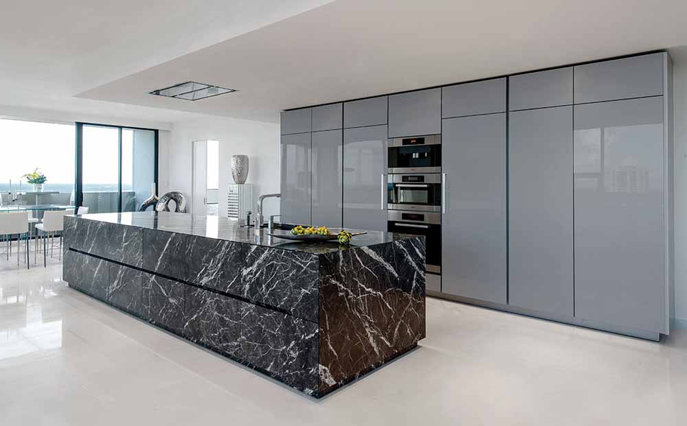 unique stone island in Grigio Carnico marble and Silver Metallic Acrylux Calgary cabinetry finish unique stone island in Grigio Carnico marble and Silver Metallic Acrylux Calgary cabinetry finish
