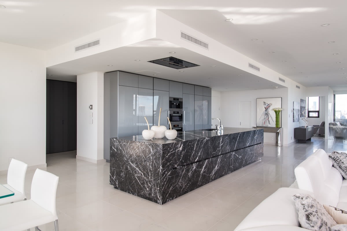 luxury custom kitchen in black, gray, and white