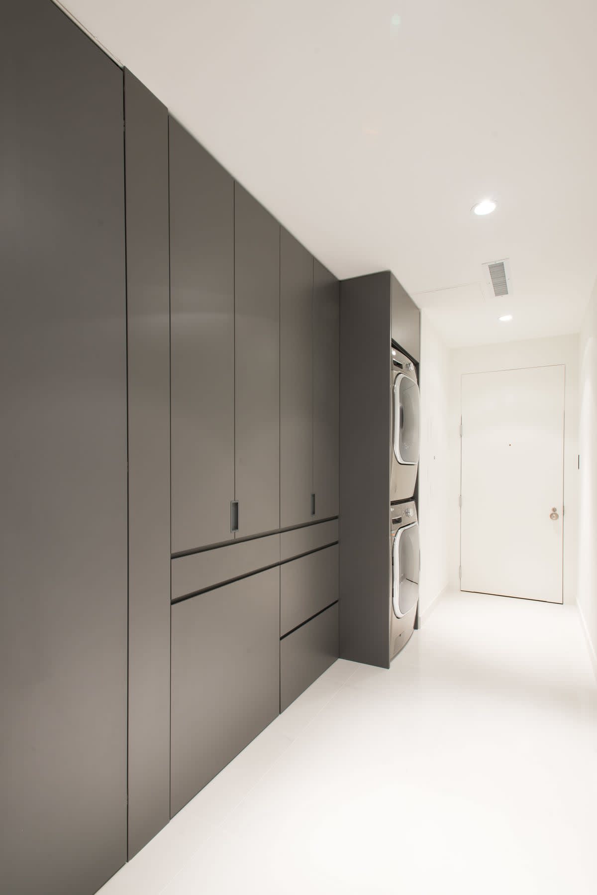 utility room with hidden office space