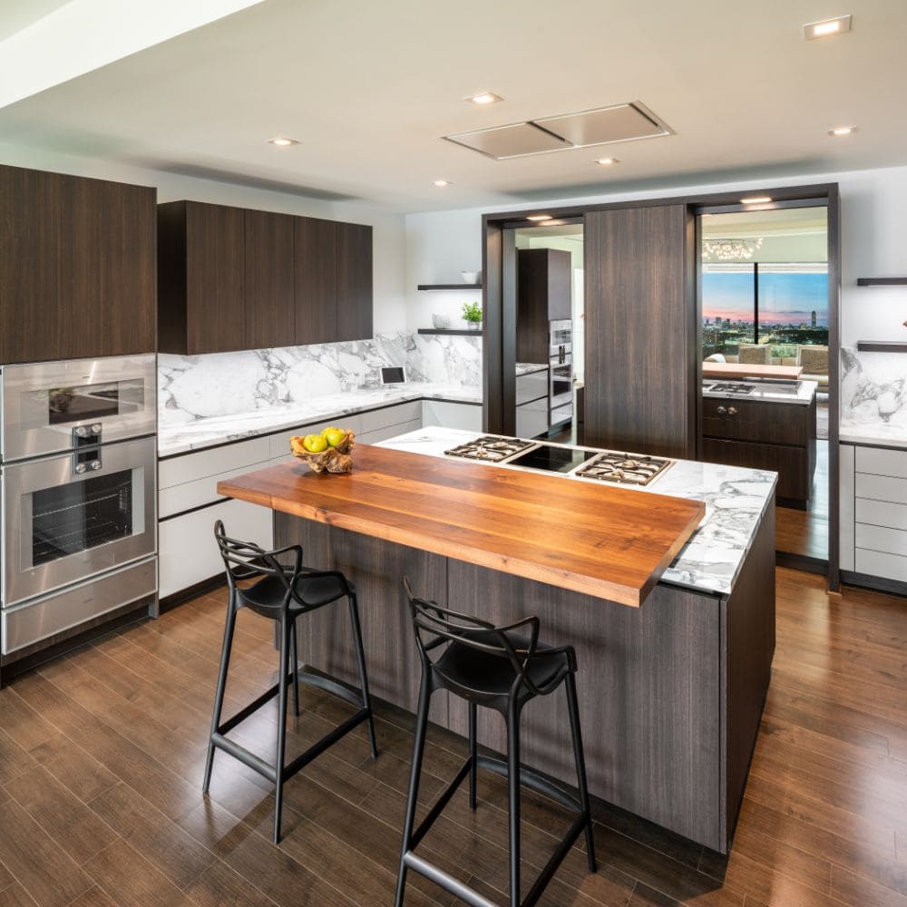 high-end kitchen in dark and light palette designed by eggersmann for the paramount highrise in houston