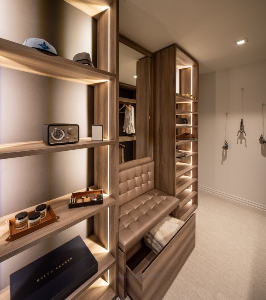 storage shelves in a schmalenbach walk-in closet feature led lighting