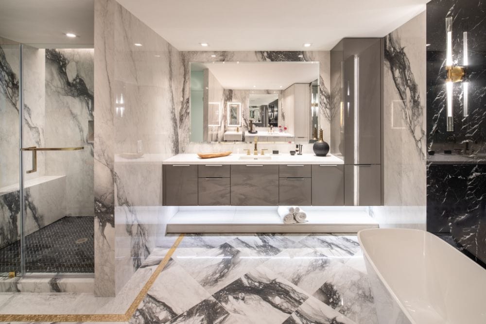 luxury german cabinetry with tall storage cabinet in marble master bathroom designed by eggersmann