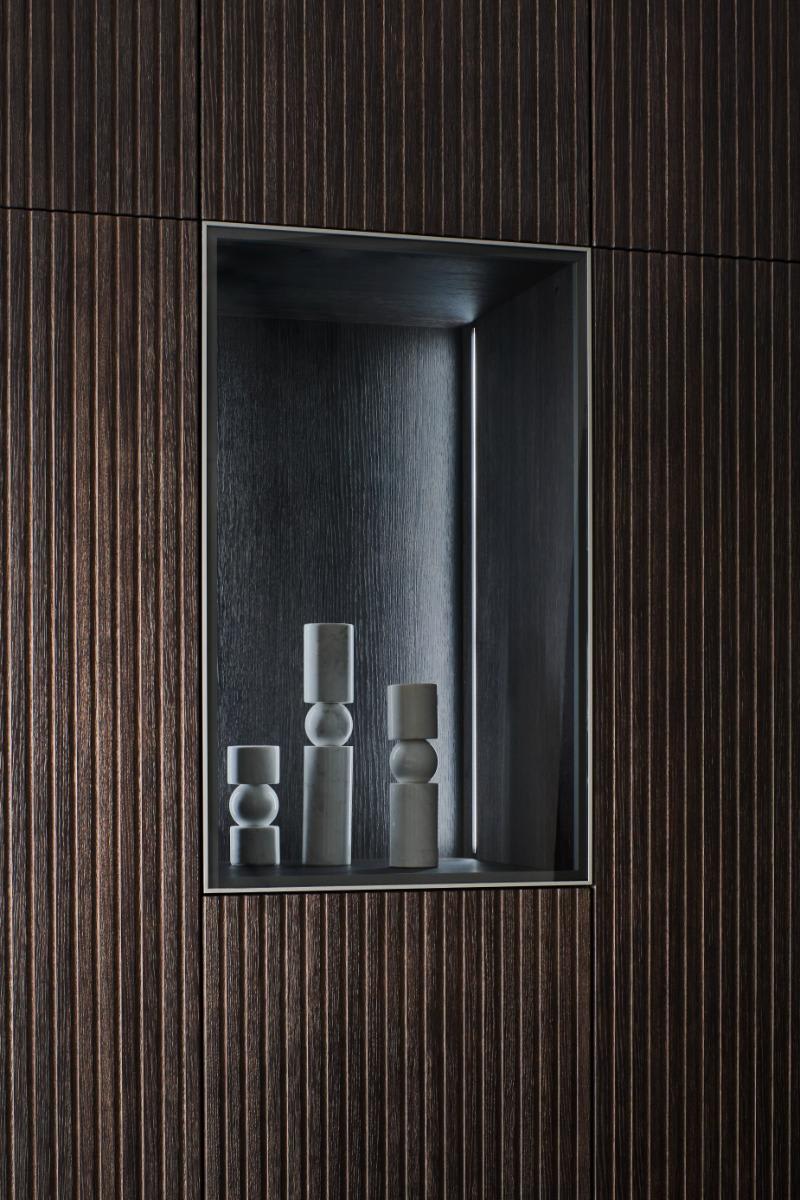 art niche in wall cabinetry claed in lausanne tamboured veneer in smoked grey brown brushed bicolor finish