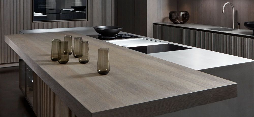 contrasting wood veneer plank style kitchen island extension in a luxury kitchen with wall cabinetry in lausanne dentil style wood veneer finish