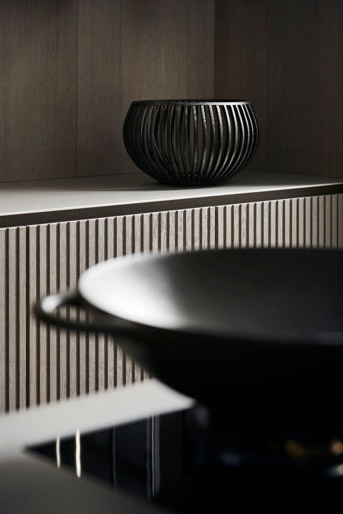 kitchen cabinetry featuring lausanne tambour style wood veneer finish