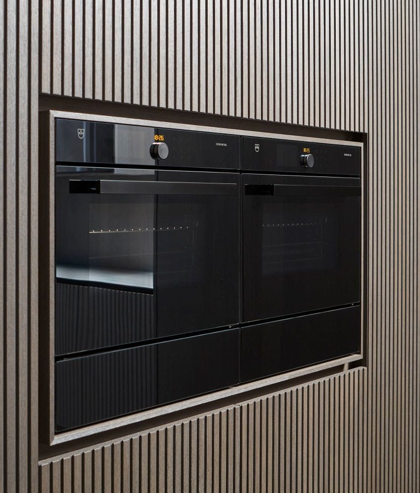 luxury oven set into e4 wall cabinetry with lausanne tambour style wood veneer finish