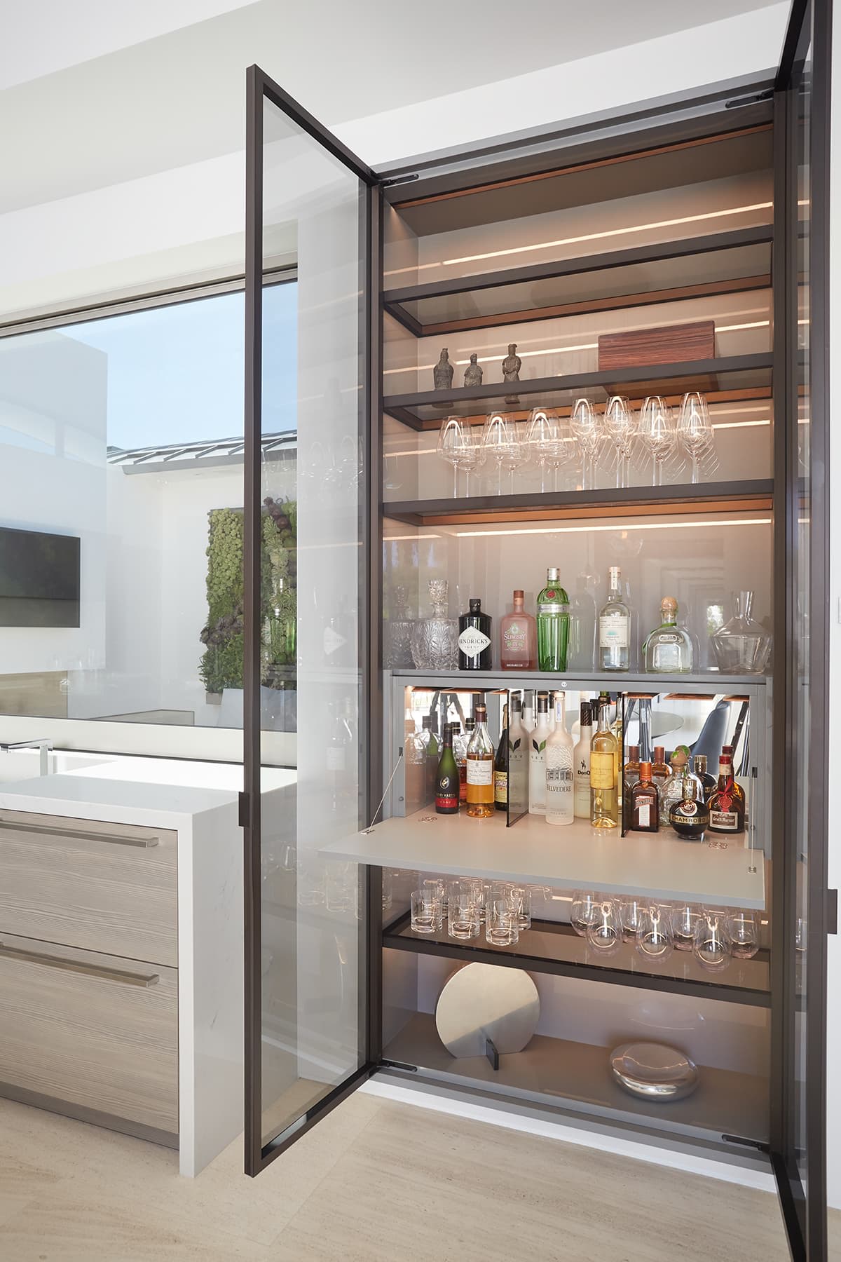 eggersmann lighting adds interest to the shelves and objects behind glass doors