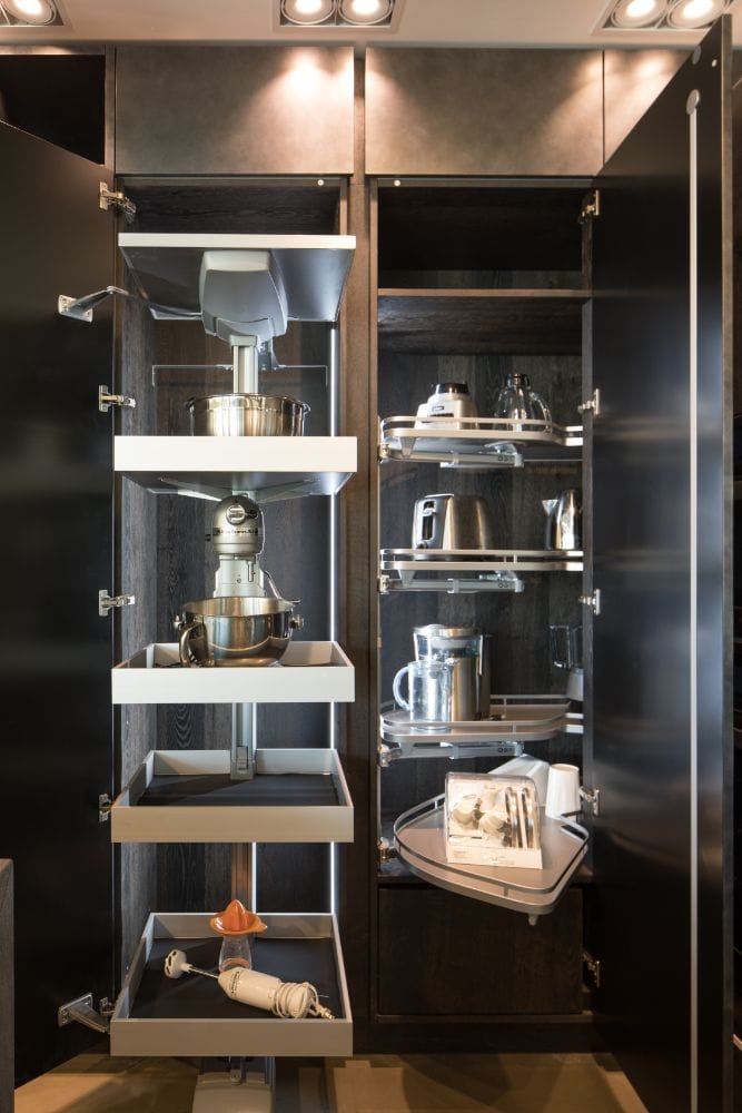 led lighting throughout pantry shelving makes it easy to find the right appliance or food item