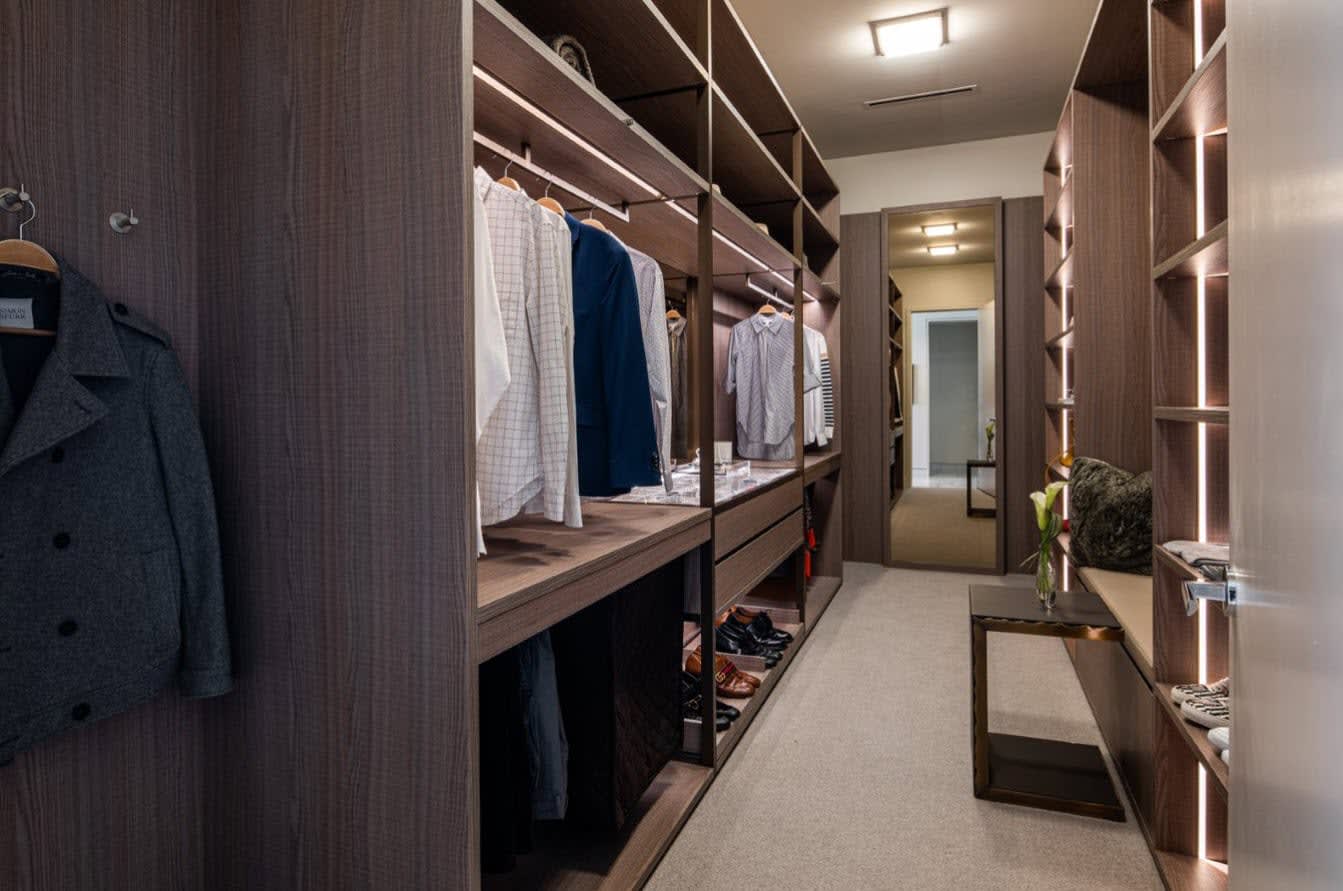 luxury walk-in wardrobe designed by eggersmann and custom manufactured by schmalenbach for hall arts residences in dallas texas