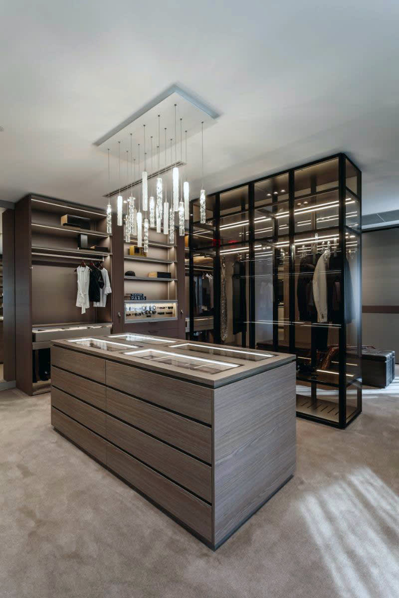 luxury lighting by shakuff constructed form a dozen hand-blown thin glass pendants suspended from a brushed nickel base