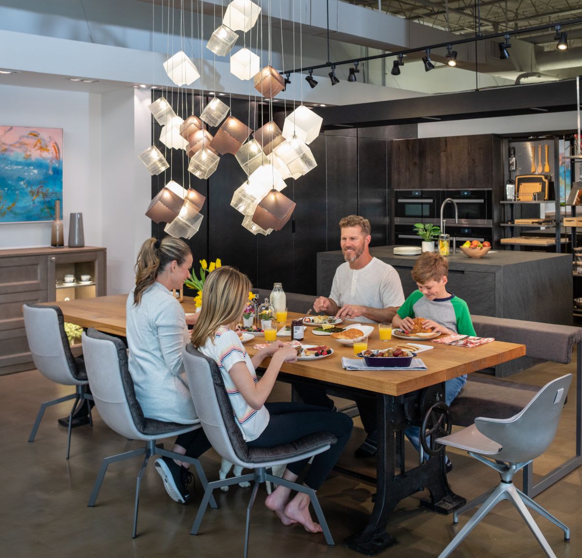 family eating a home-cooked meal in luxury dining chairs custom-designed by eggersmann