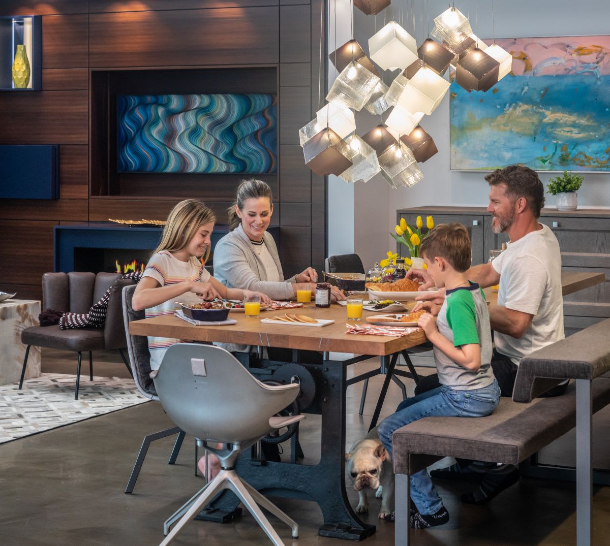 family eating around a custom dining table with chairs by eggersmann