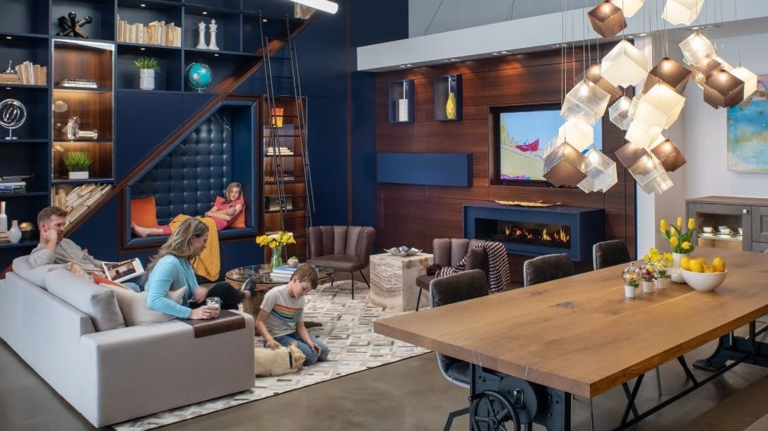 family enjoying a luxury living and media room design by eggersmann