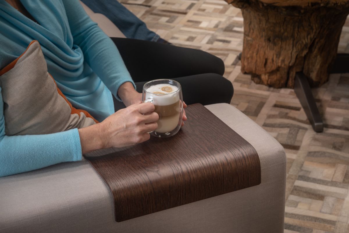 wood arm protector adds high-end touch to a bespoke sofa manufactured by sophisticated living designed by eggersmann