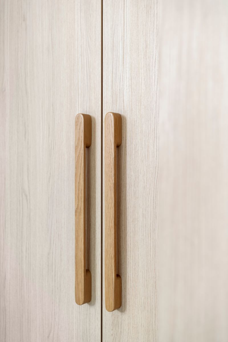 low profile ultra-modern cabinet handles on tall cabinets in a luxury kitchen designed by eggersmann in la silver lake