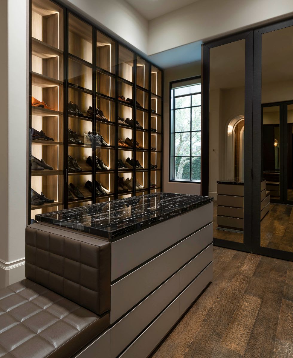 the closet for "him" in a dallas preston hollow mansion after renovation by eggersmann