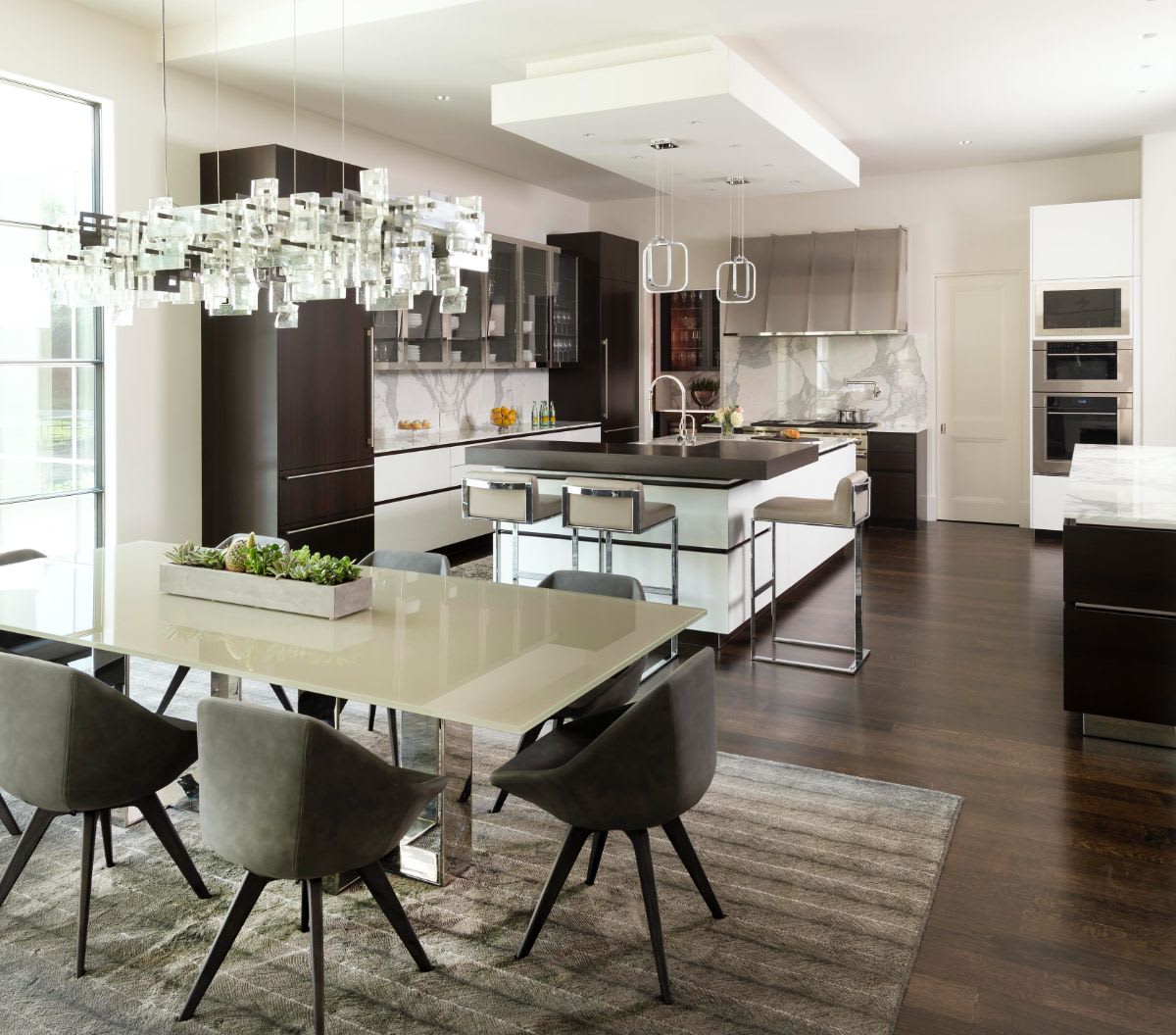 a dallas preston hollow mansion's kitchen and dining area after renovation by eggersmann