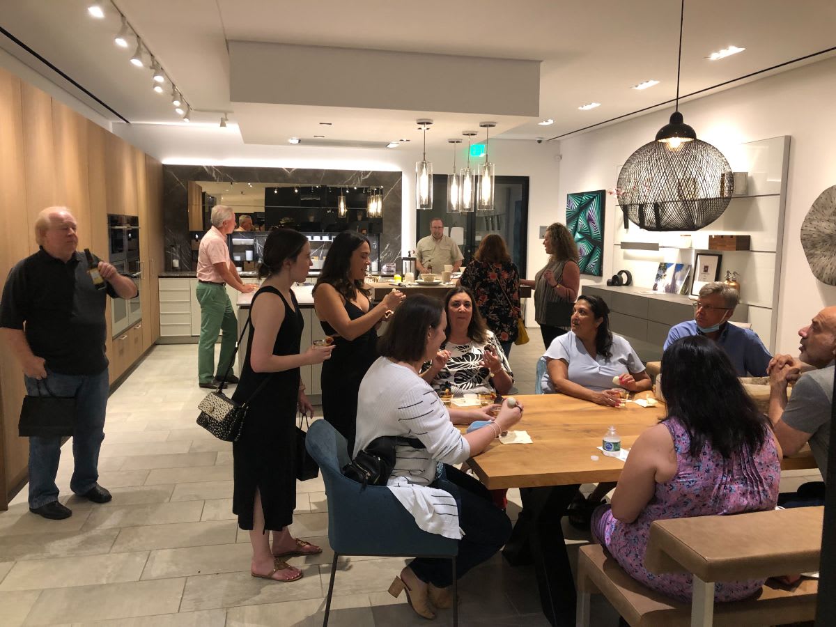 attendees enjoying the refreshments and conversation with fellow designers at curated 2021 art exhibition and dallas design district showroom tour