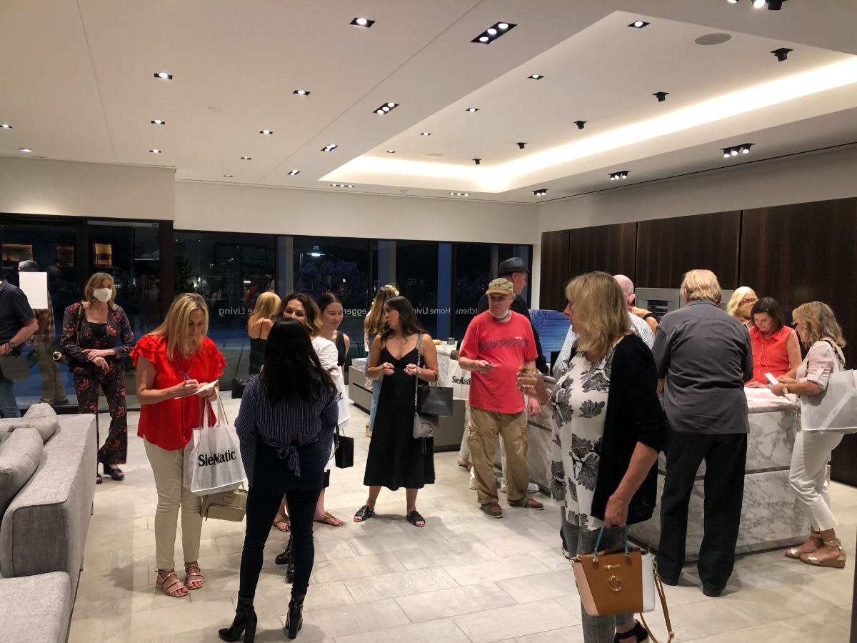 attendees at curated 2021 art exhibition and dallas design district showroom tour