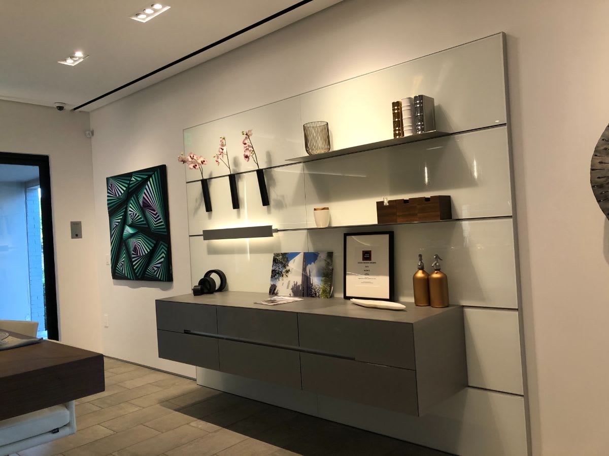 hot rooled steel credenza with didem yagci's "evolution" painting mounted to its left