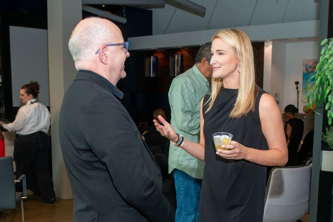 jennifer copes of modern luxury intreriors texas enjoying talking with renown architect and professor dietmar froehlich