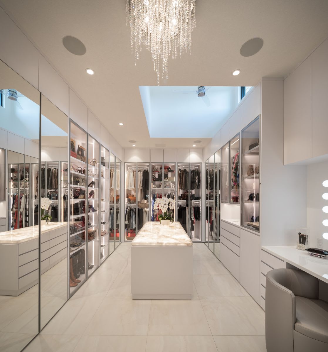 luxury walk-in closet designed by eggersmann for a sugar lakes home in sugar land texas