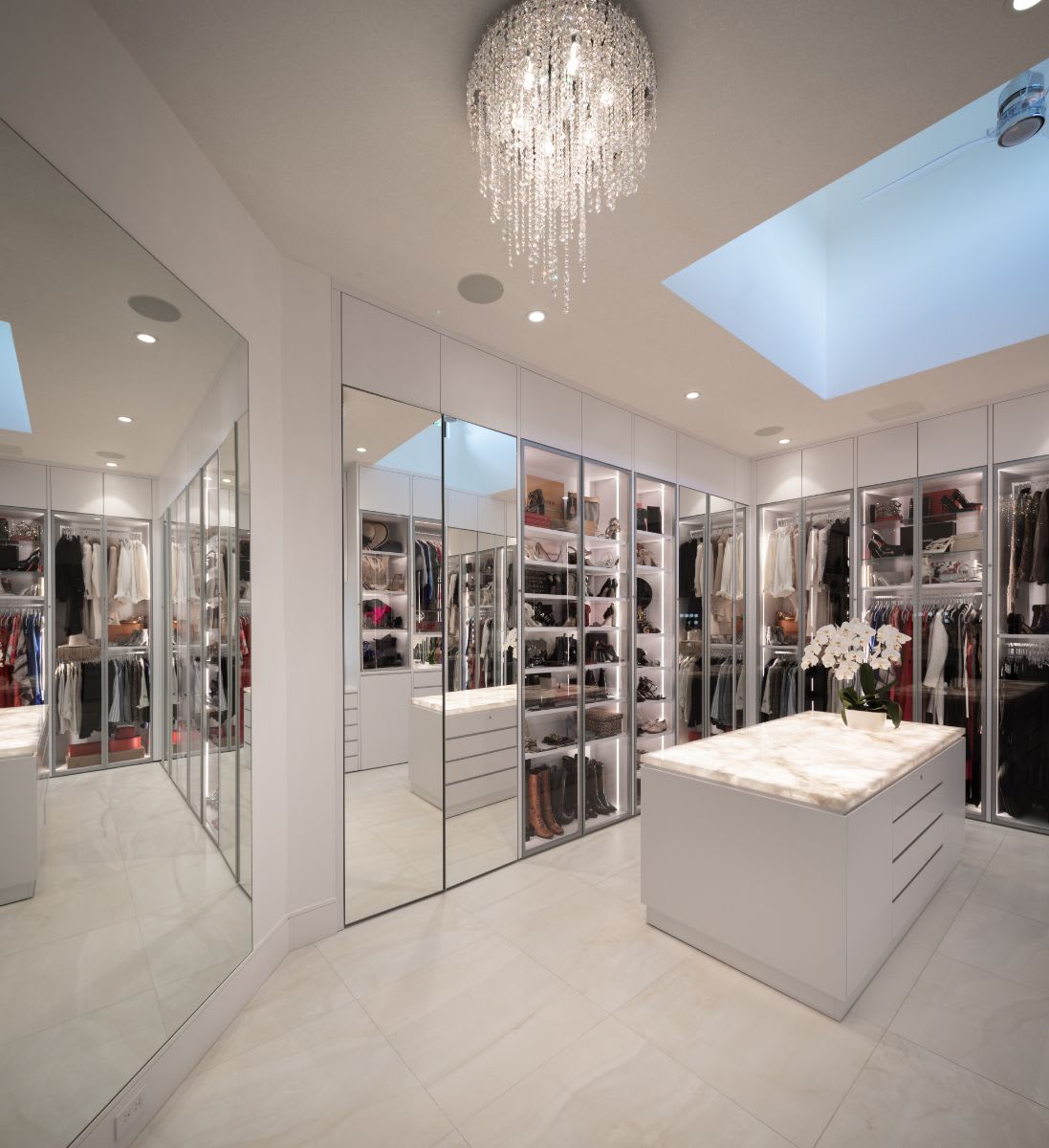 light-up counter top in a luxury walk-in closet designed for the lady of a sugar lakes home in sugar land texas