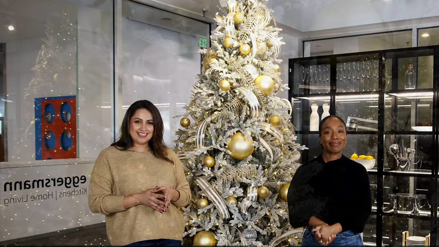 jacqueline montez and judi igwe, houston-based organizer, standing in front of a christmas tree to give tips on taking down the christmas tree