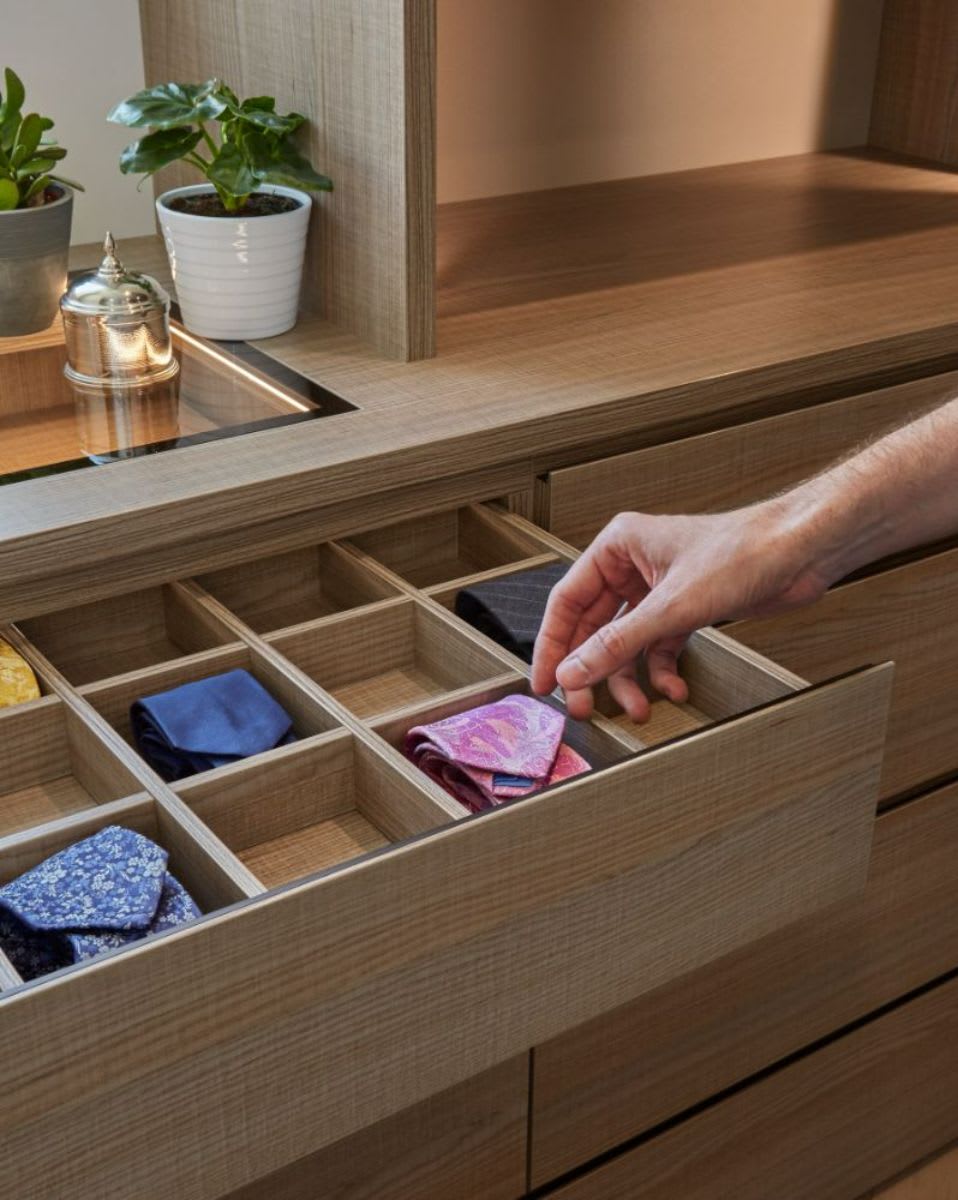 Acrylic drawer dividers maximize the use of this drawer for ties