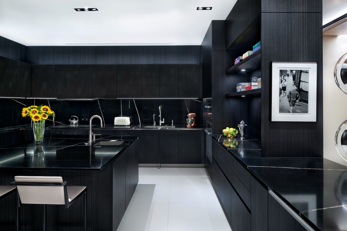 german cabinetry, shelving, and drawers of one side of a U-shaped kitchen designed by eggersman for an austonian high-rise residence in austin texas