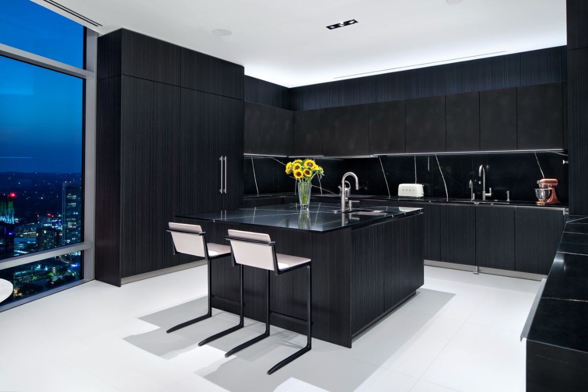 eggersmann-designed kitchen of an austonian high-rise residence in austin texas with incredible nightview of the skyline