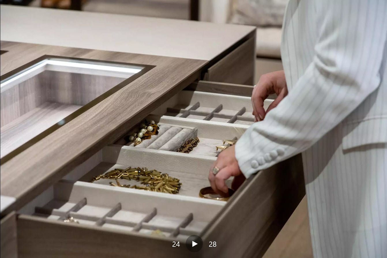 custom jewelry drawers in a closet island with glass-top for an elegant look and easy viewing
