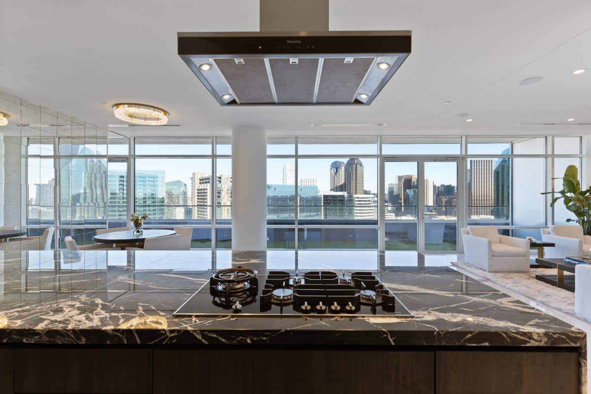 miele cooktop and hood in a kitchen island from eggersmann's unique cabinetry collection