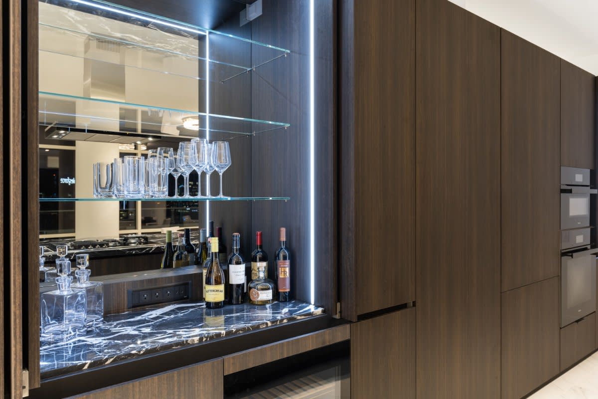 luxury bar with open pocket doors in a w dallas high-rise kitchen