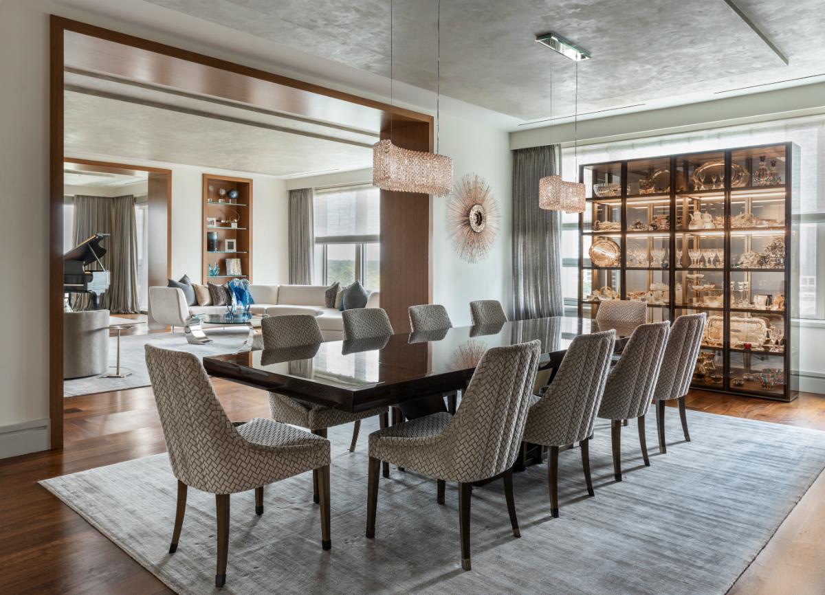 luxury dining room featuring modern china and curio cabinet with integrated led lighting crafted by schmalenbach designed by eggersmann houston with jennifer burgess loh