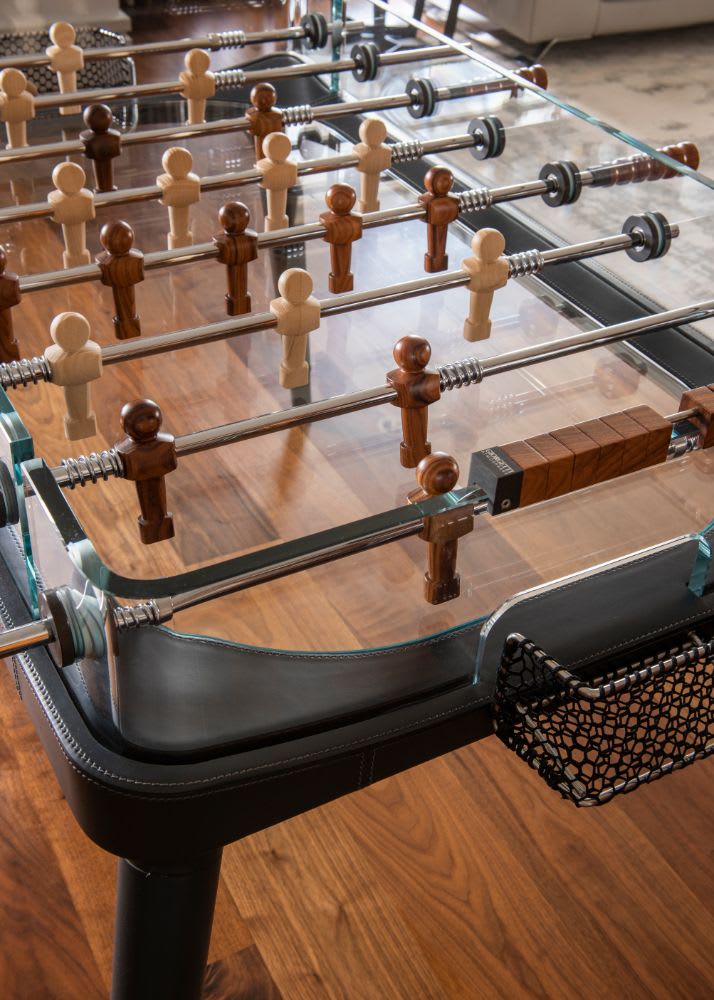 foos ball table in the living area of a belfiore residence in houston