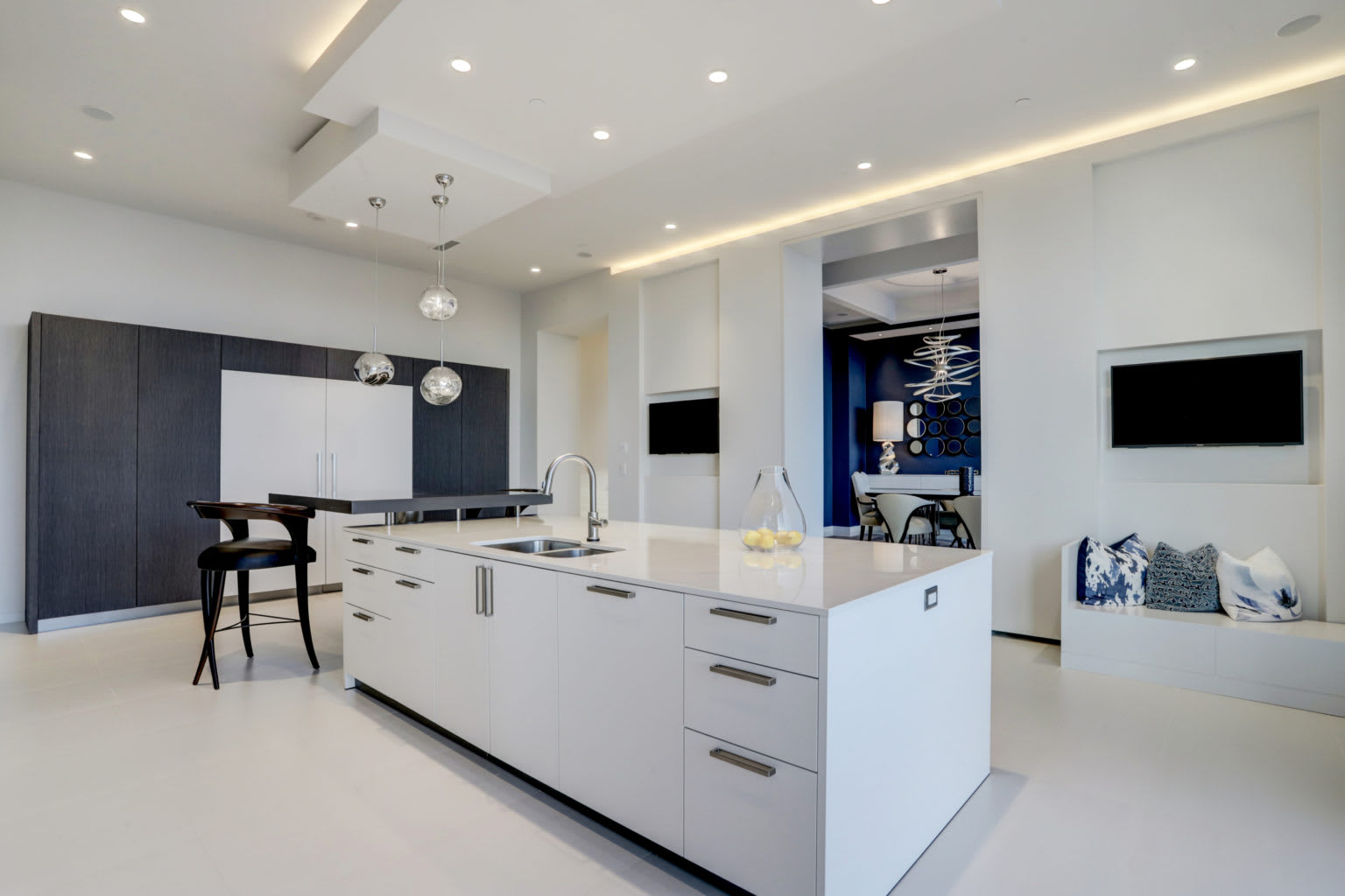 black and white kitchen with wood veneer cabinets