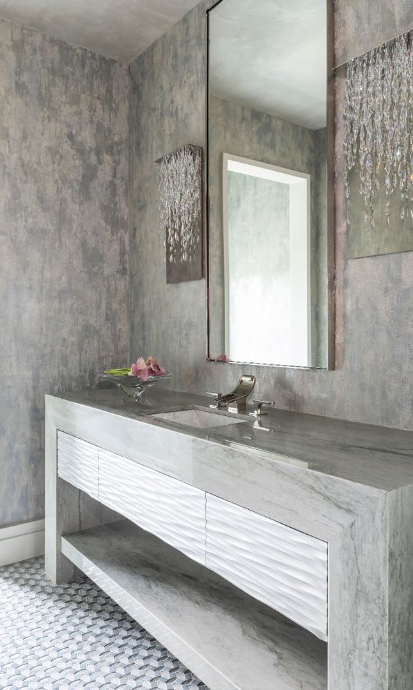 luxury stone vanity in a powder room vanity in a belfiore residence